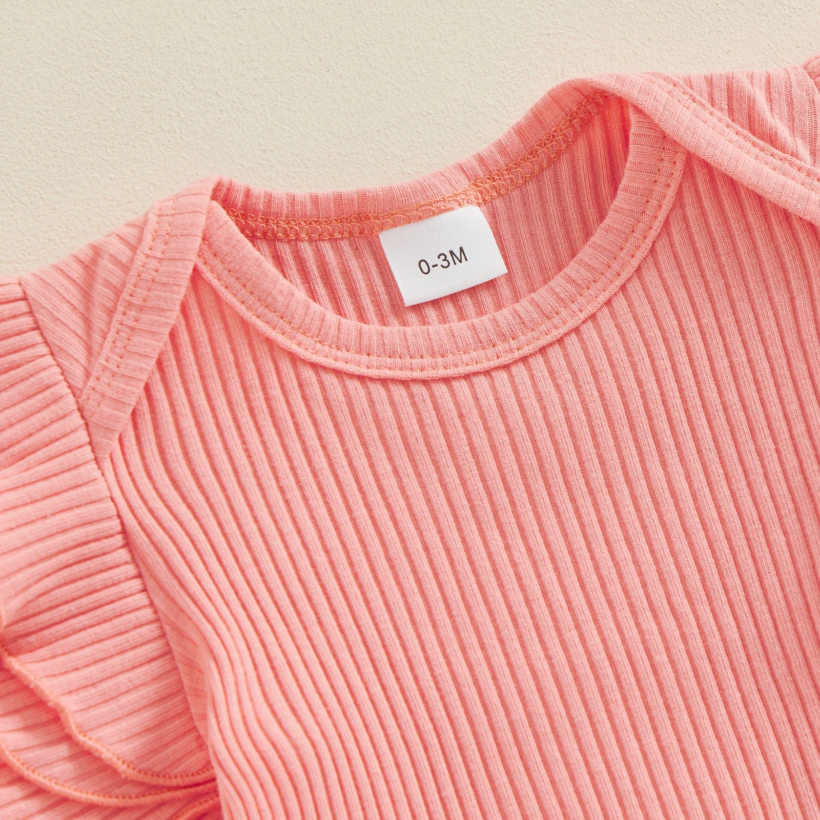 MILA Ruffle Sleeve Onesie