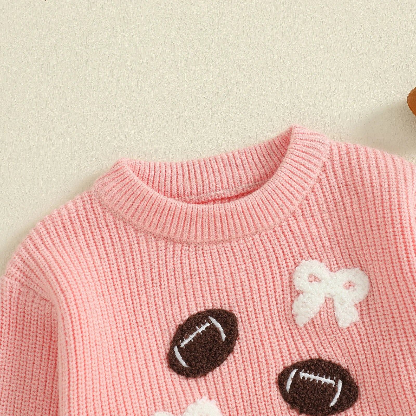 FOOTBALLS & BOWS Knitted Sweater