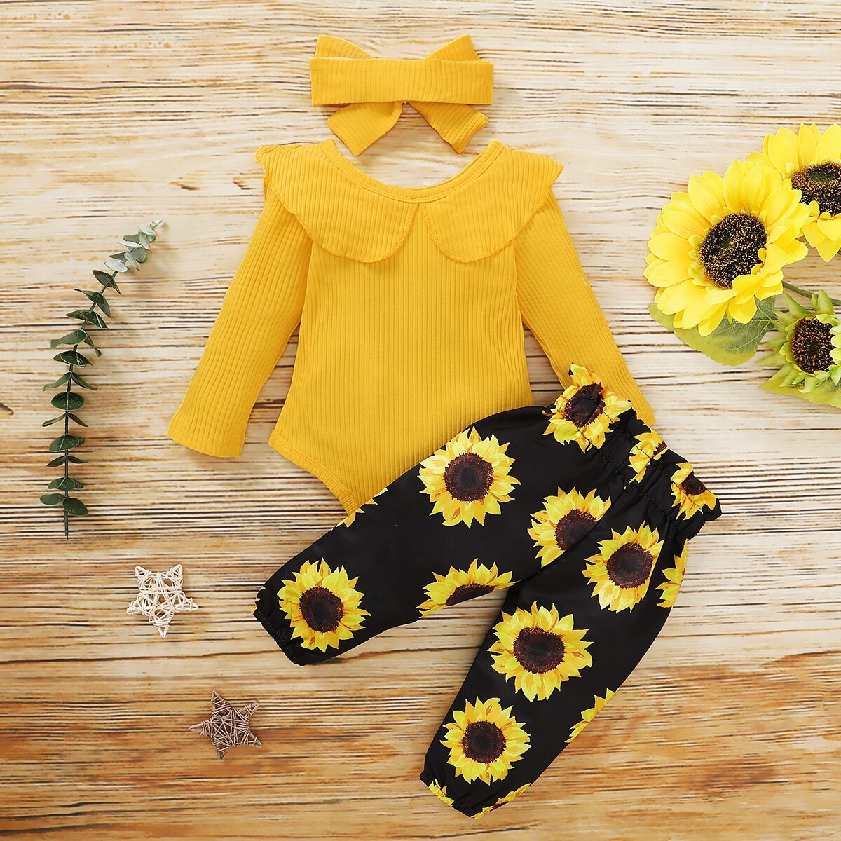 https://hazelandbo.com/cdn/shop/products/Citgeett-Autumn-Infant-Baby-Girls-Set-Clothes-Yellow-Flared-Long-Sleeve-Jumpsuit-Sunflower-Bow-Long-Pants_63d8c634-5b95-4f88-8c25-2fe1b6eb2f49_2000x.jpg?v=1623317653