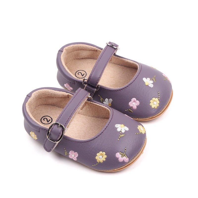 infant purple dress shoes A pair of lilac baby booties finished with Italian embroidered cuffs. Available in newborn and 0-3 month sizing